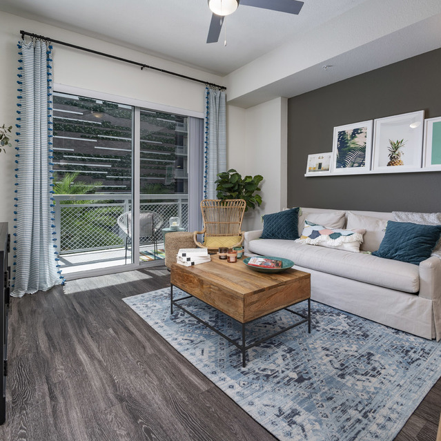 Blu27 - Living Room with Wood-style Flooring and White Couch