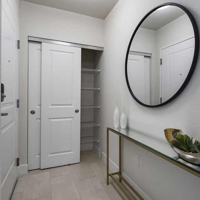 Blu27 - Hallway with a Large Mirror leading to Storage